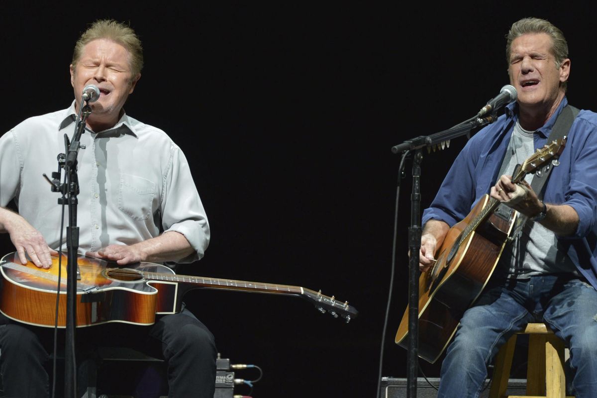 FILE – In this Jan. 15, 2014, file photo, Don Henley, left, and Glenn Frey of The Eagles perform on the "History of the Eagles" tour at the Forum in Los Angeles. The Eagles