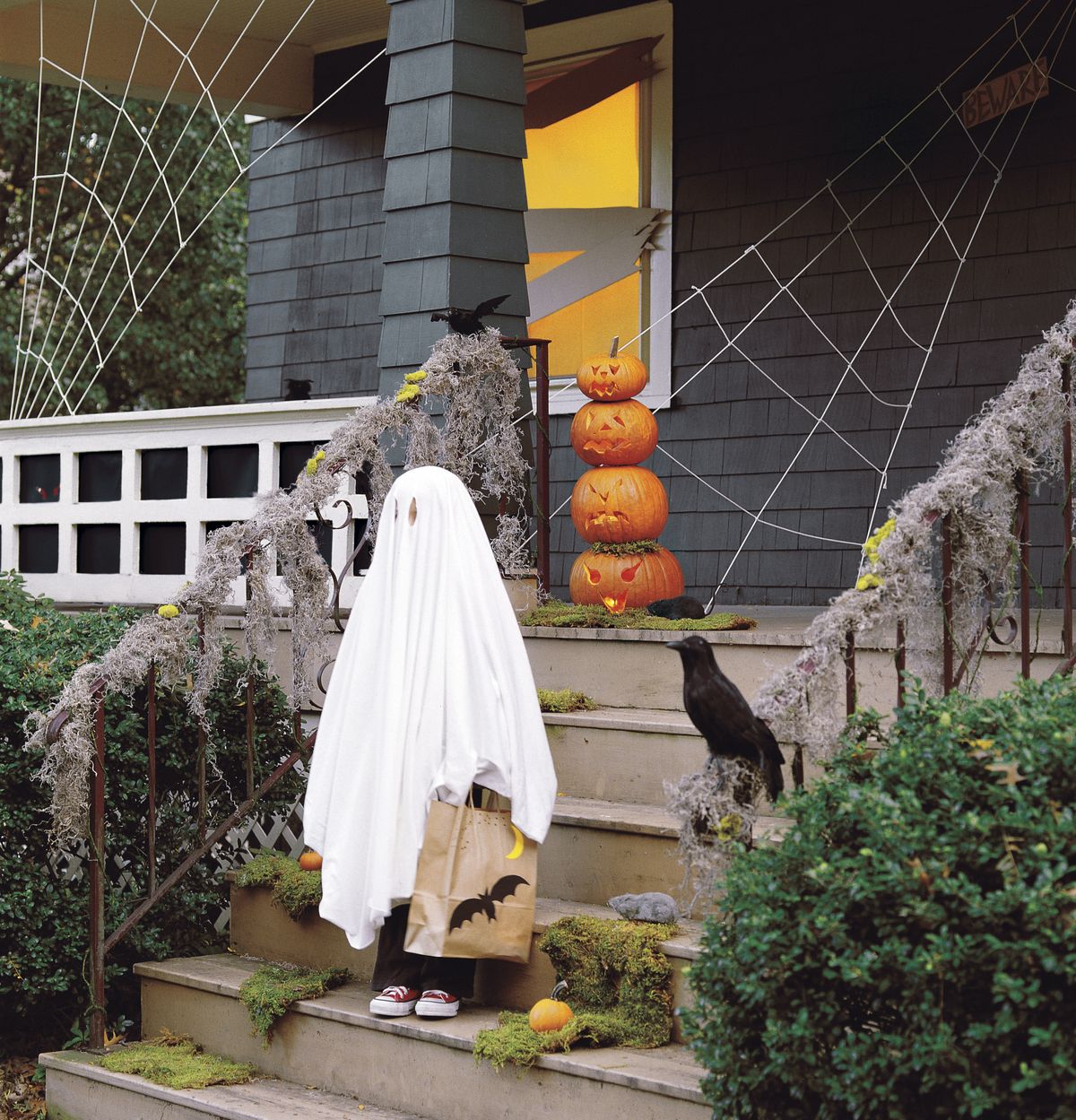 William Waldron shows the front of a home decorated for Halloween. This photo was originally published in the 2011 Martha Stewart Halloween Special Issue. (Associated Press)