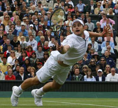 
Third-seeded Andy Roddick dives to return the ball en route to victory over Thailand's Danai Udomchoke.Associated Press
 (Associated Press / The Spokesman-Review)