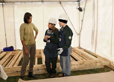 First lady Michelle Obama visits students with the YouthBuild AmeriCorps community service program last month  in Washington.  (Associated Press / The Spokesman-Review)