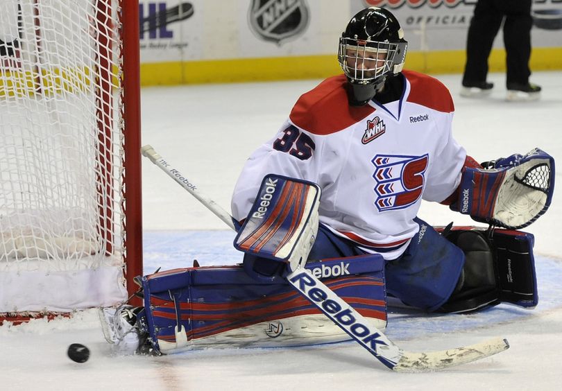 Chiefs goalie, Eric Williams makes a save against Vancoucer in the first period, March 27, 2012 in the Spokane Arena. (Dan Pelle / The Spokesman-Review)