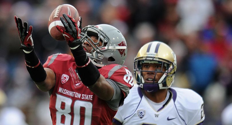 Washington State's Dominique Williams hauls in a long pass. (Tyler Tjomsland)
