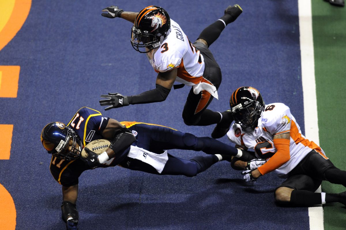 With Milwaukee players Virgil Gray (3) and Tracy Belton (6) in pursuit, wide receiver Huey Whittaker (17) scores the first Spokane Shock touchdown in the first quarter Friday April 2, 2010 in the Spokane Arena. colinm@spokesman.com COLIN MULVANY (Colin Mulvany / The Spokesman-Review)