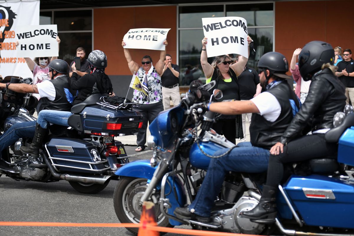 The End of Watch Ride to Remember honoring the law enforcement officers who were killed in the line of duty in 2019 arrives home to cheers Thursday at Lone Wolf Harley-Davidson in Spokane Valley.  (Colin Mulvany/THE SPOKESMAN-REVIEW)