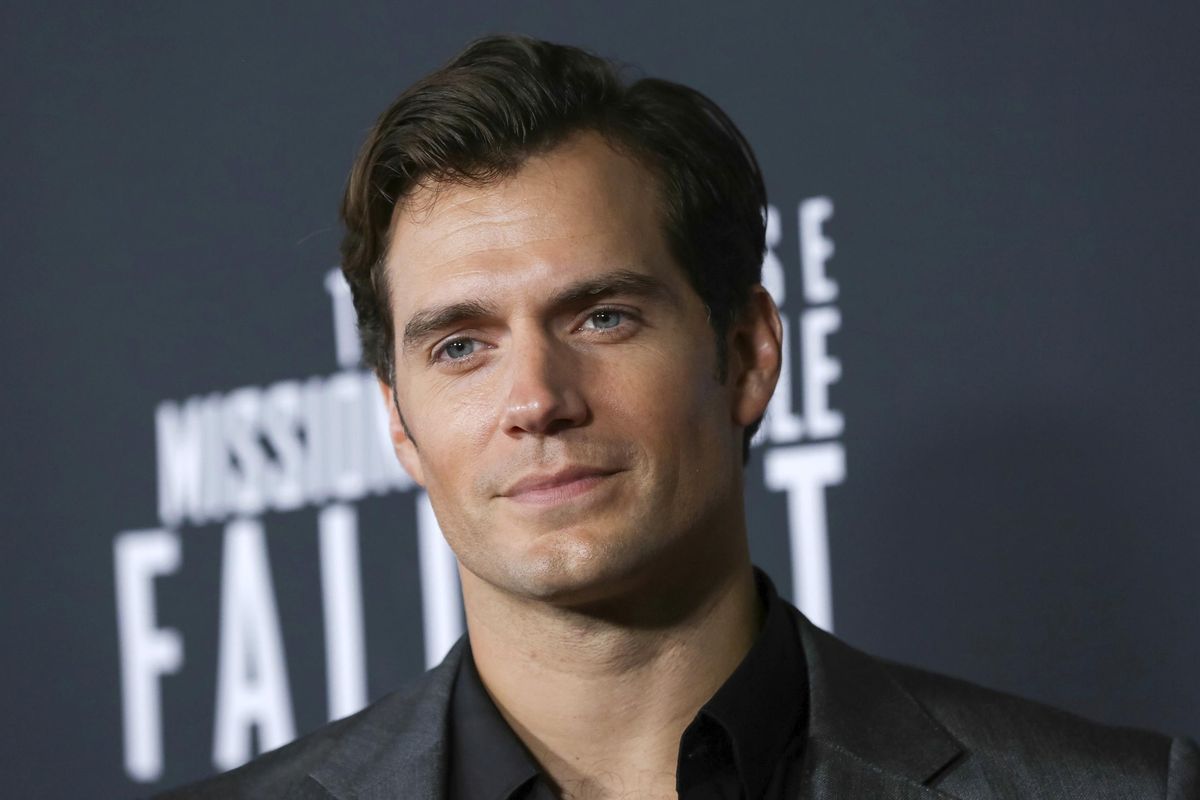 CORRECTS AUTHOR NAME - FILE - In this July 22, 2018 file photo, actor Henry Cavill attends the U.S. premiere of "Mission: Impossible - Fallout" in Washington. Cavill dons a long white wig to play monster hunter Geralt of Rivia in "The Witcher," an ambitious eight-episode adaptation of Polish author Andrzej Sapkowski