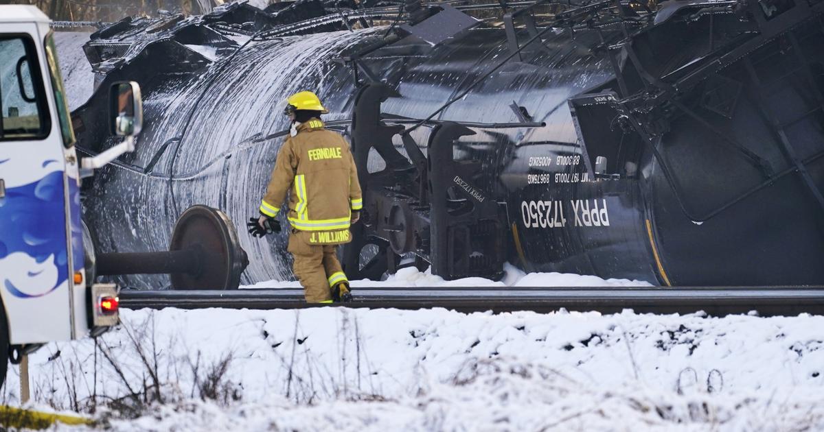 Federal officials investigate fiery oil train derailment