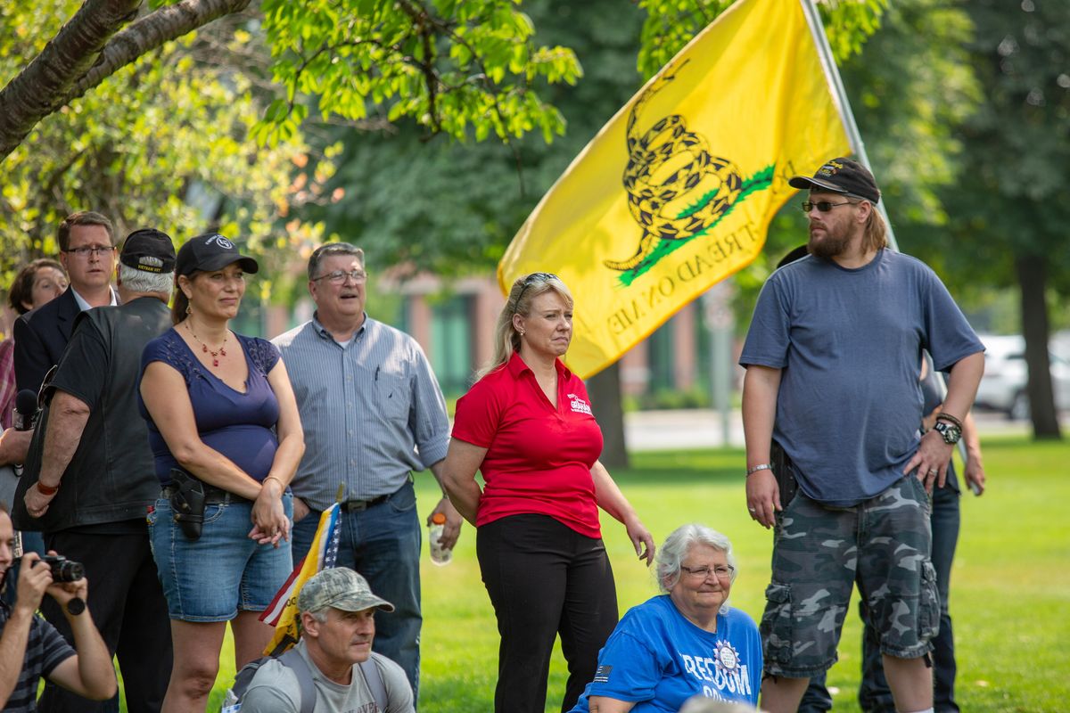 Jenny Graham, a candidate for the Sixth Legislative District House seat, stands among the crowd at the Liberty or Death Rally on Aug. 18, 2018 in Franklin Park. (Libby Kamrowski / The Spokesman-Review)