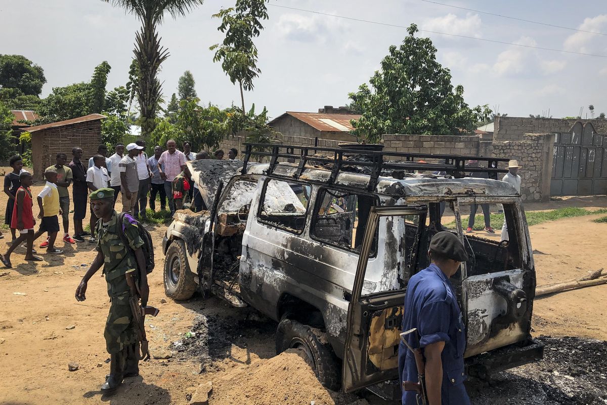 Congolese security forces attend the scene after the vehicle of a health ministry Ebola response team was attacked in Beni, northeastern Congo Monday, June 24, 2019. A driver working with the team is in critical condition after angry crowds hurled rocks at him and set the vehicle on fire, in the latest attack to strike efforts to combat the virus that has killed more than 1,500 people in eastern Congo since the outbreak began last August. (Al-hadji Kudra Maliro / Associated Press)
