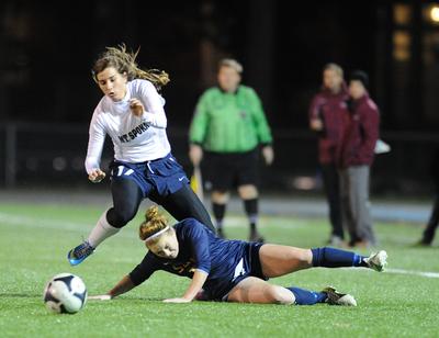 Mt Spokane's Amanda Bergstrom hops over Southridge's Haley Thomas in a battle for the ball on Tuesday. (Tyler Tjomsland)