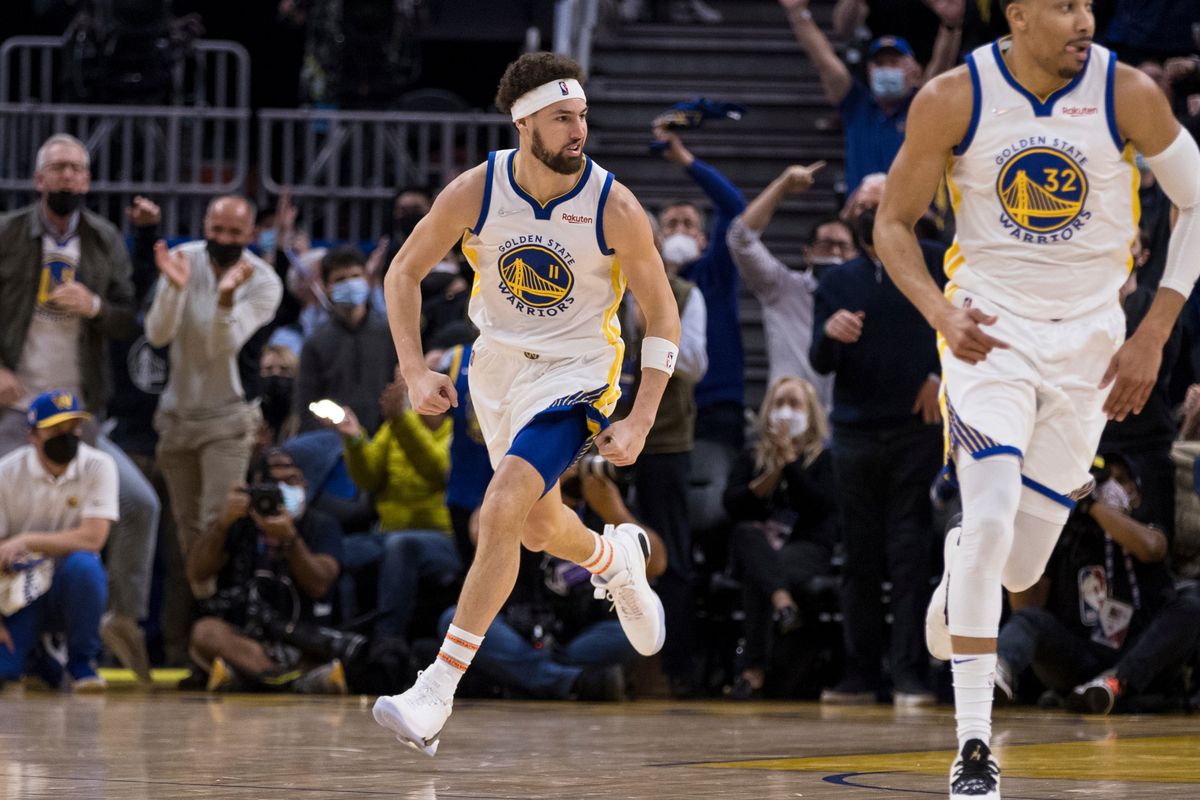 Golden State Warriors guard Klay Thompson (11) runs downcourt after scoring against the Cleveland Cavaliers during the first half of an NBA basketball game in San Francisco, Sunday, Jan. 9, 2022.  (Associated Press)
