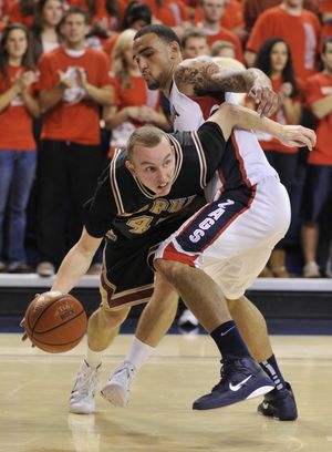Gonzaga's Robert Sacre trys to contain IUPUI's John Ashworth in the second half Sunday, Nov. 14, 2010 in the McCarthey Athletic Center. (Colin Mulvany / The Spokesman-Review)