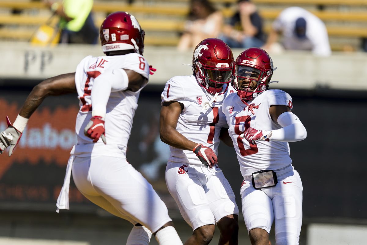 Washington State wide receiver Calvin Jackson Jr. (8) celebrates with wide receiver Travell Harris (1) and wide receiver Calvin Jackson Jr. (8) after scoring a touchdown against California in the first quarter of an NCAA football game in Berkeley, Calif., Saturday, Oct. 2, 2021.  (Associated Press)
