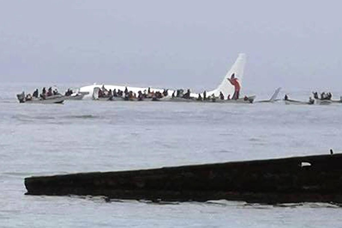This photo provided by Blue Flag shows a crash-landing of an Air Niugini plane in Pacific lagoon near Chuuk Airport in Weno, Federated States of Micronesia, Friday, Sept. 28, 2018. All of the passengers and crew survived the crash landing. The Air Niugini plane hit the water short of the runway while trying to land at Chuuk Island, according to the airline. (Associated Press)