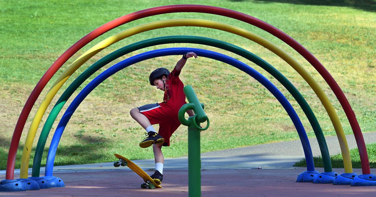 Issac Rogers, age 13, catches himself after slipping off his skateboard at Audubon Park during a break from his home school classes, Sept. 16, 2016. (Dan Pelle / The Spokesman-Review)