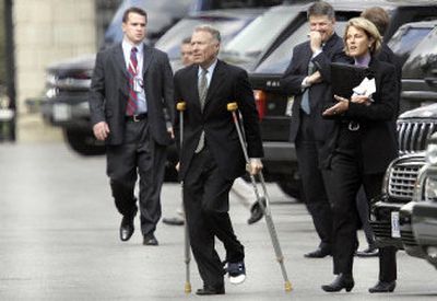 
I. Lewis 'Scooter' Libby, Vice President Dick Cheney's chief of staff, walks out of the White House using crutches Thursday. Libby faces a possible indictment over the leaking of the name of a covert CIA agent. 
 (Associated Press / The Spokesman-Review)