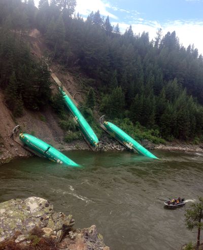 Work crews are expected today at the scene, shown here Saturday, where a freight train derailed near Alberton in Western Montana, sending three cars carrying Boeing 737 fuselages down an embankment into the Clark Fork River. Montana Rail Link spokeswoman Lynda Frost said 19 cars from the westbound train derailed Thursday.