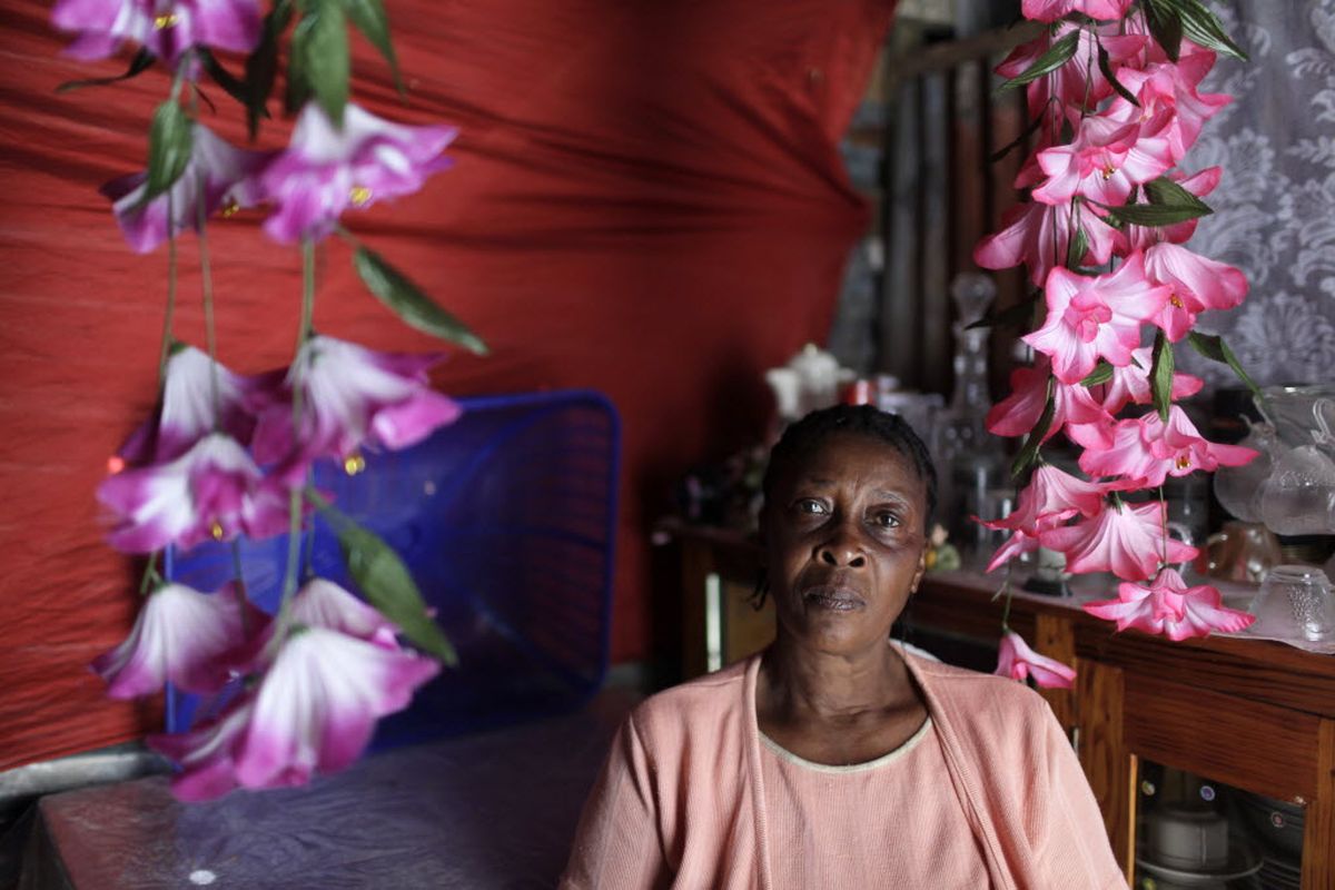 Melanie Augustin, 58, poses for a photo in the rebuilt area of her home in the mountain village of Callebas, Haiti, Wednesday, Feb. 3, 2010. Augustin says she gave her 10-year-old daughter Jozin to American Baptist missionaries who promised to give the child a better life. (Associated Press)