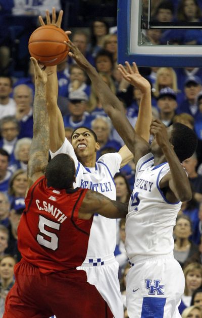 Kentucky put the pressure on Louisville’s Chris Smith during a Dec. 31 game. (Associated Press)