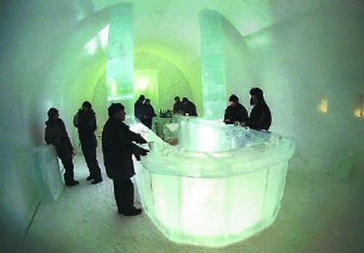 
Guests use glasses made of ice at the bar which is made of ice in the Jukkasjarvi Ice hotel in northern Sweden.
 (The Spokesman-Review)