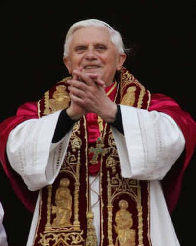 
Newly elected Pope Joseph Ratzinger of Germany gestures to the crowd from a balcony of St. Peter's Basilica, at the Vatican, on Tuesday. 
 (Associated Press / The Spokesman-Review)