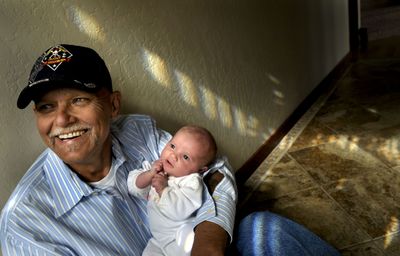 Tony Marohn holds his 1-month-old daughter, Thelia, at his home in Coeur d’Alene on  April 17. He and Brett Evans are working on a home for disabled veterans. (Kathy Plonka / The Spokesman-Review)