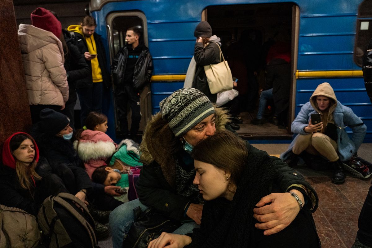Hundreds of people take shelter inside a metro station as explosions are heard in downtown Kharkiv, Ukraine, on Feb. 24, 2022, the day Russia