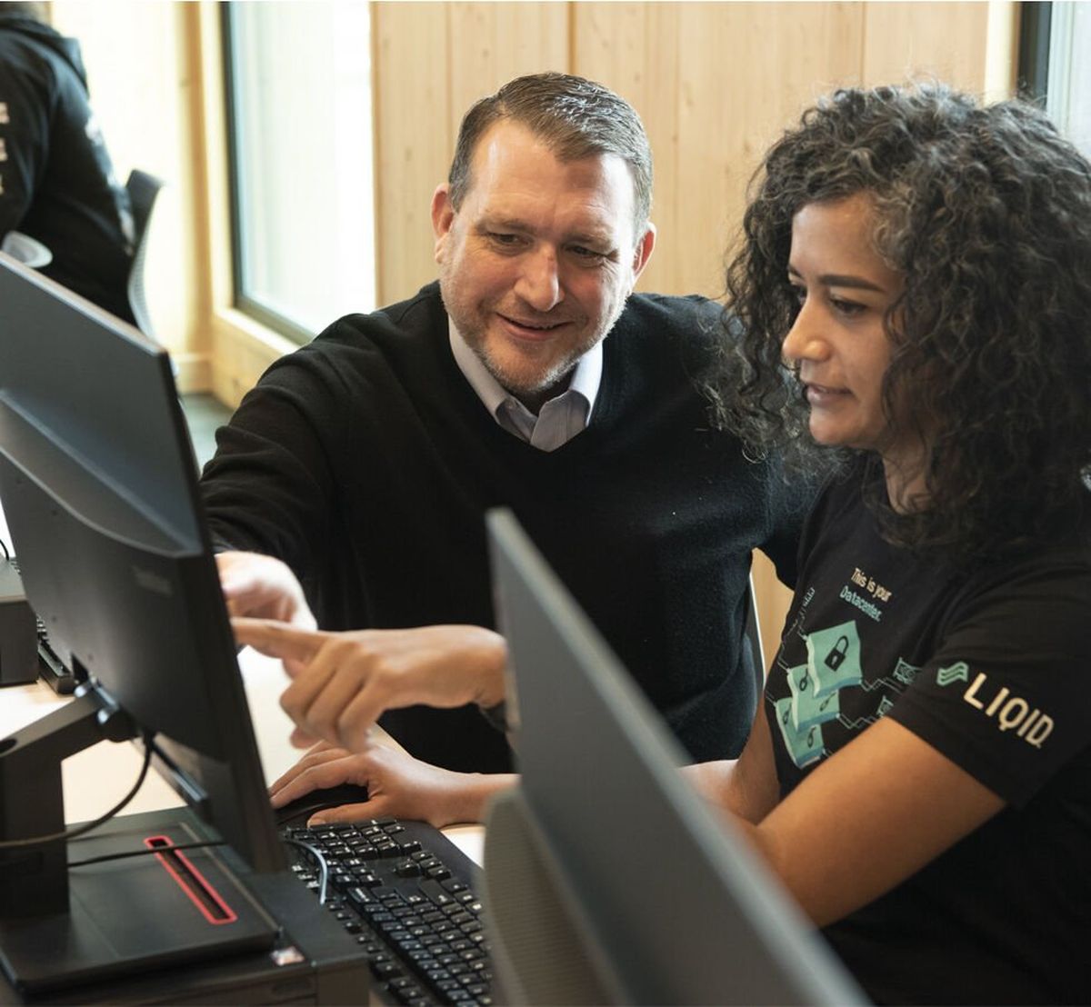Stu Steiner, EWU assistant professor of computer science and electrical engineering, and student Amy Washington take part in the Spokane Mayor’s Cup Cybersecurity Competition in this February 2022 photo. Steiner is working with students to assist local governments in preventing cyberattacks.  (Courtesy of Eastern Washington University)