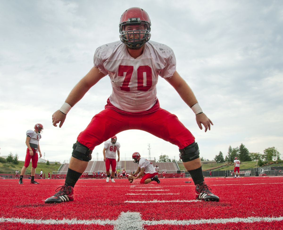 Eastern Washington University offensive lineman Steve Forgette works on his long snaps for field-goal attempts during practice. (Dan Pelle)