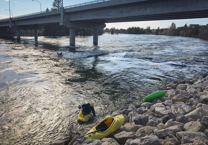 With the Spokane River at flood stage, experienced kayakers found challenging fun well within their skill level at Dead Dog Hole at the state line before local officials banned access to the river.  (Brian Jamieson)