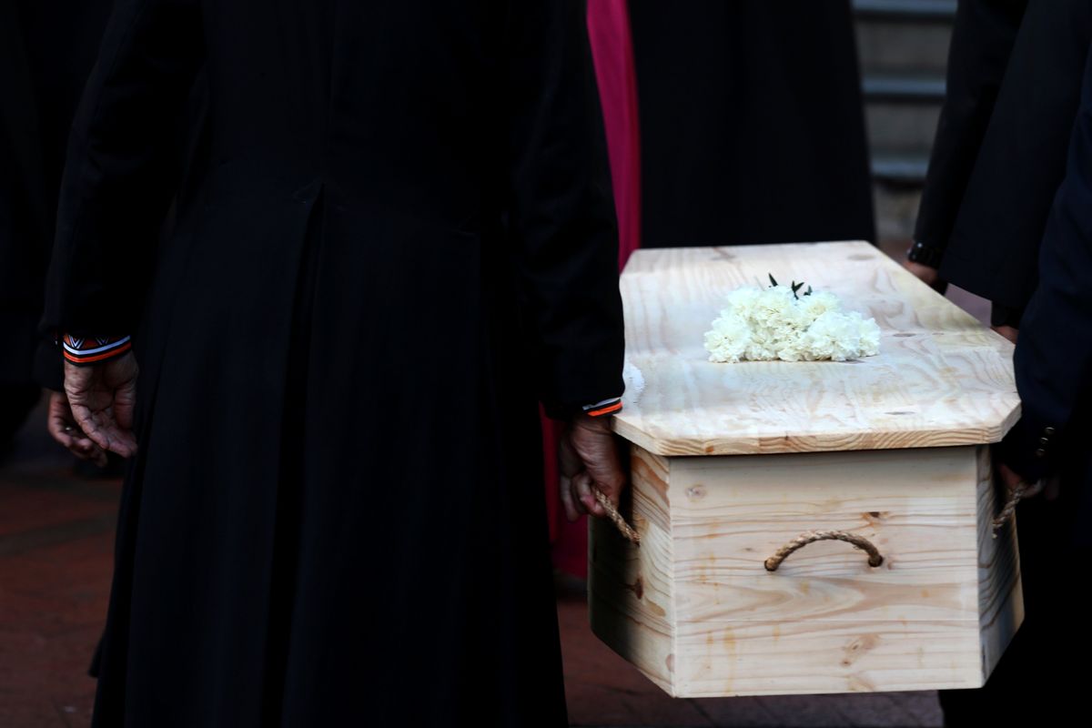 The coffin carrying Anglican Archbishop Emeritus Desmond Tutu is carried into the St. George