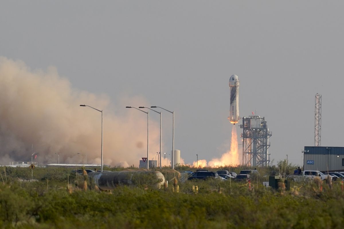 Blue Origin's New Shepard rocket launches carrying passengers Jeff Bezos, founder of Amazon and space tourism company Blue Origin, brother Mark Bezos, Oliver Daemen and Wally Funk, from its spaceport near Van Horn, Texas, Tuesday, July 20, 2021.  (Tony Gutierrez)