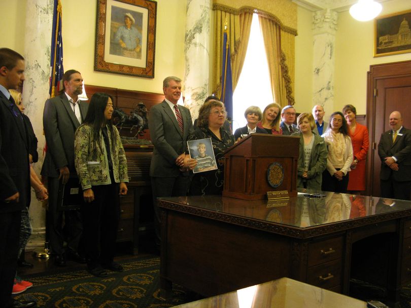 Backers of anti-bullying bill join Gov. Butch Otter at bill-signing ceremony Monday (Betsy Russell)