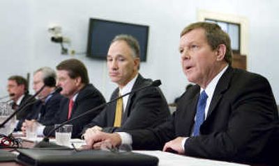 
Robert Malone, of BP America, right, accompanied by other oil company executives, testifies Tuesday on Capitol Hill before the House Select Committee on Energy Independence and Global Warming. Associated Press
 (Associated Press / The Spokesman-Review)