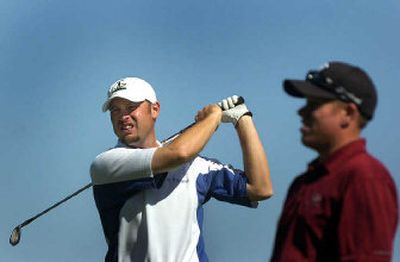
First-round co-leader Troy Kelly, left, warms up on the first tee Friday morning before shooting a second-round 69 at The Fairways.  
 (Jed Conklin / The Spokesman-Review)