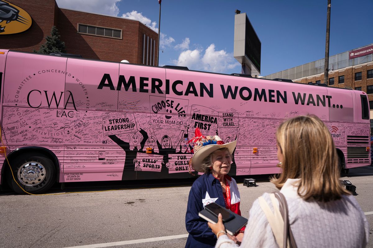 The Young Women For America pink bus covered in signatures of Republican National Convention attendees in downtown Milwaukee on the second day of the event.  (Sara Stathas/For The Washington Post)