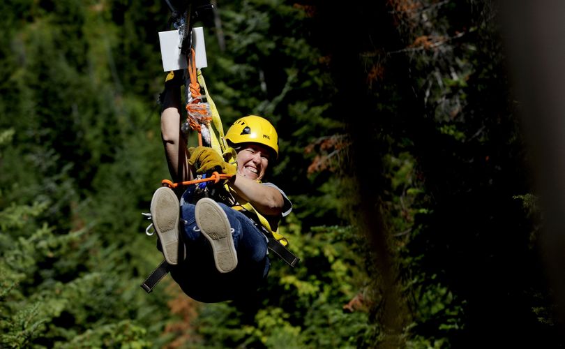 “Oh my God,” said Julia Jakaber, of Otis Orchards, as she zipped through the trees in Wallace on Aug. 16. She and her sisters booked the adventure with Silver Streak Zipline Tours as a birthday present for their father, Ted Wentz. (Kathy Plonka)