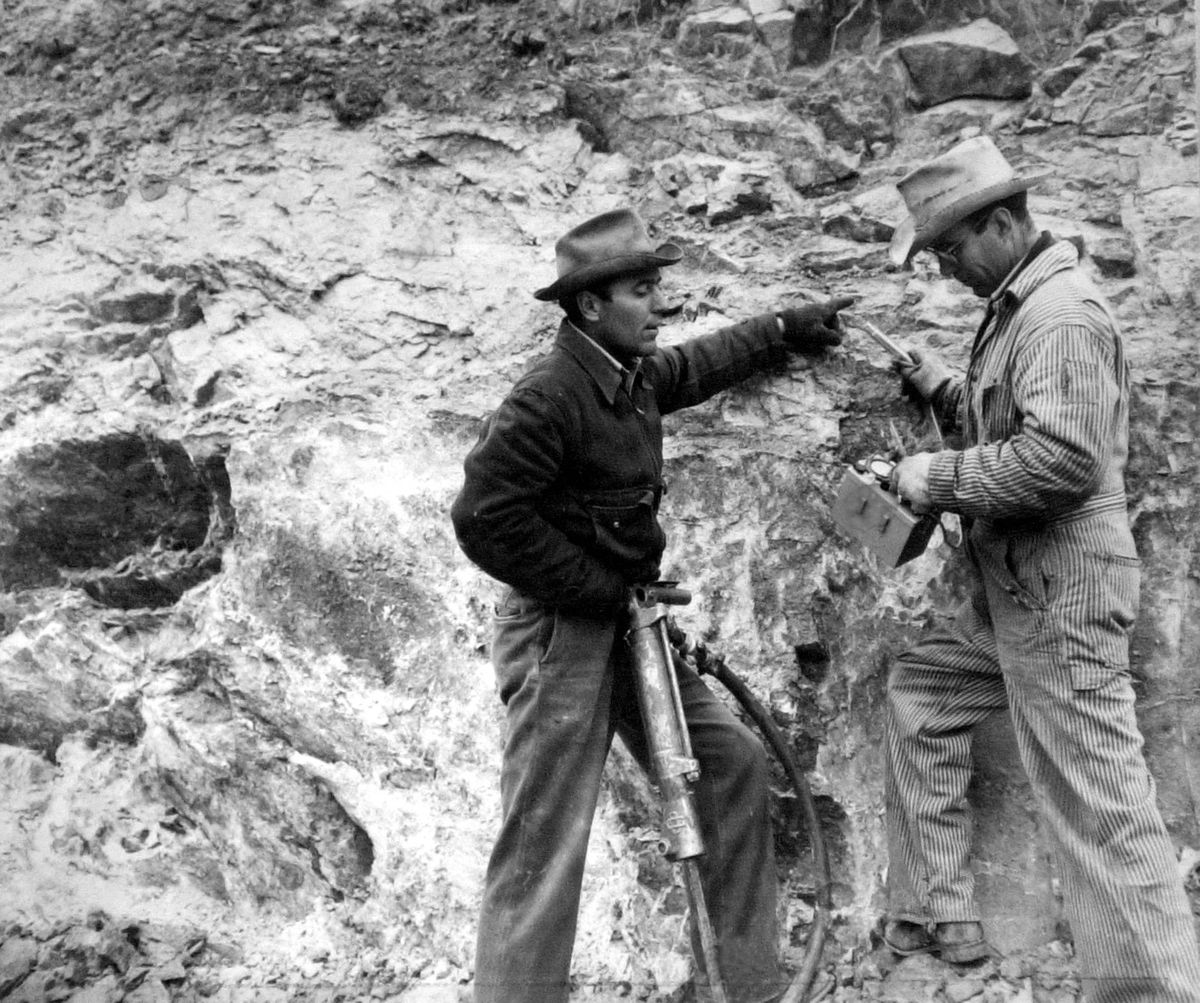 John LaBret points to a "hot" spot while his twin brother James tests for radioactivity with a Geiger Counter at the future Midnite Mine on the Spokane Indian Reservation in a 1954 photo. (The Spokesman-Review photo archive / SR)