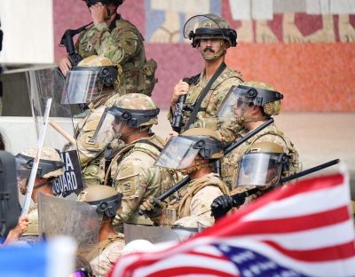California National Guard members guard the entrance to the Edward Royal Federal Building on June 15 in Los Angeles.  (Jay Calderon/Desert Sun)