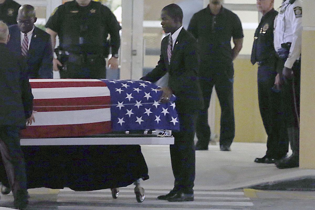The casket of Sgt. La David T. Johnson of Miami Gardens, who was killed in an ambush in Niger. is wheeled out after a viewing at the Christ The Rock Church, Friday, Oct. 20, 2017 in Cooper City, Fla. (PEDRO PORTAL / Associated Press)