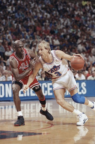 Cleveland Cavaliers guard Craig Ehlo, right, drives past Michael Jordan of the Chicago Bulls during an Eastern Conference championship game May 25, 1992, in Richfield, Ohio. (Mark Duncan / AP)