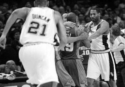
San Antonio's Robert Horry, right, and Phoenix's Raja Bell take part in shoving match Monday night.
 (Associated Press / The Spokesman-Review)