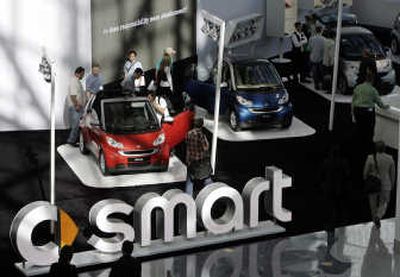 
People examine Daimler AG's Smart Car at the Los Angeles Auto Show last week.Associated Press
 (File Associated Press / The Spokesman-Review)