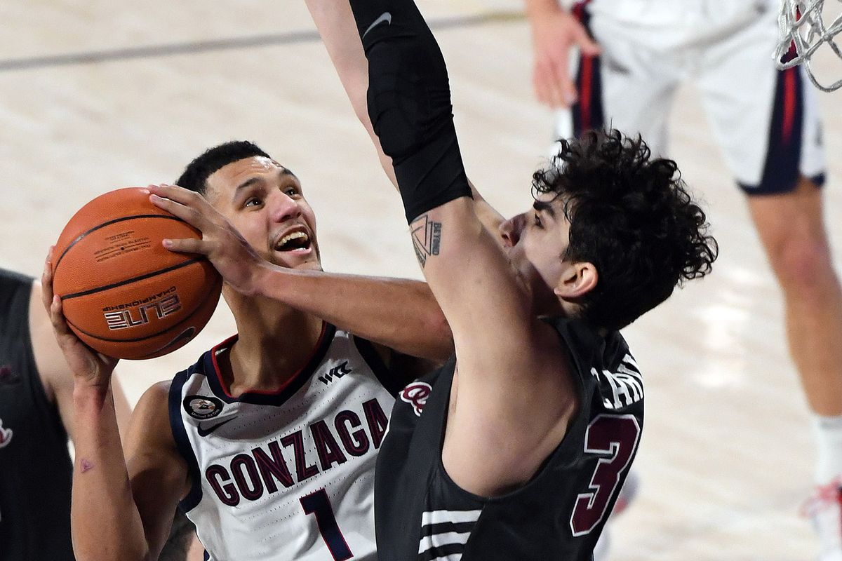 Gonzaga guard Jalen Suggs (1) heads to the basket as Santa Clara forward Guglielmo Caruso (30) defends during the first half of a college basketball game, Thursday, Feb. 25, 2021, in the McCarthey Athletic Center.  (Colin Mulvany/THE SPOKESMAN-REVIEW)