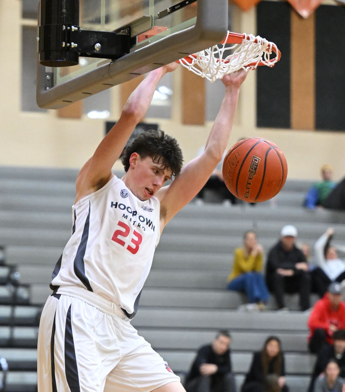 Metro forward Evan Stinson of Cheney dunks against Region during the Jack Blair Memorial on Tuesday at Lewis and Clark High School.  (Colin Mulvany/The Spokesman-Revi)