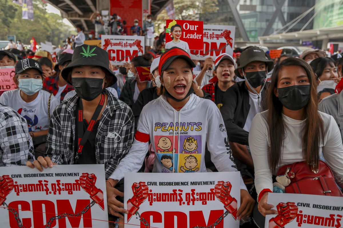 Demonstrators display placards with CDM, refers to the civil disobedience movement that has seen doctors, engineers and others in Myanmar refuse to work until the military releases elected political leaders and returns the country to civilian rule, during a protest against the military coup in Yangon, Myanmar Thursday, Feb. 18, 2021. Demonstrators against Myanmar’s military takeover returned to the streets Thursday after a night of armed intimidation by security forces in the country’s second biggest city. (STR)