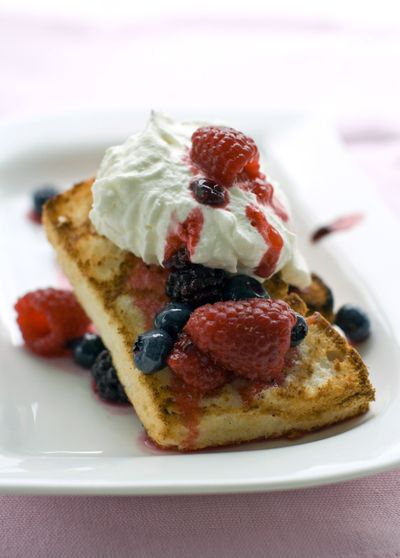 Angel food cake is a good base for summertime desserts. Grilled Angel Food Shortcakes can be topped with whipped cream and a mix of summer berries. (Associated Press)