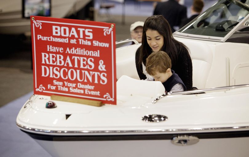 A sign of the times is posted on the bow of a boat at the 108th New York Boat Show in New York's Javits Convention Center, Wednesday, Jan. 20, 2010. (Richard Drew / Associated Press)