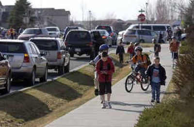 
Liberty Lake Elementary students head home after school Monday. A group of Liberty Lake residents is developing a plan to break away from the district.
 (Liz Kishimoto / The Spokesman-Review)