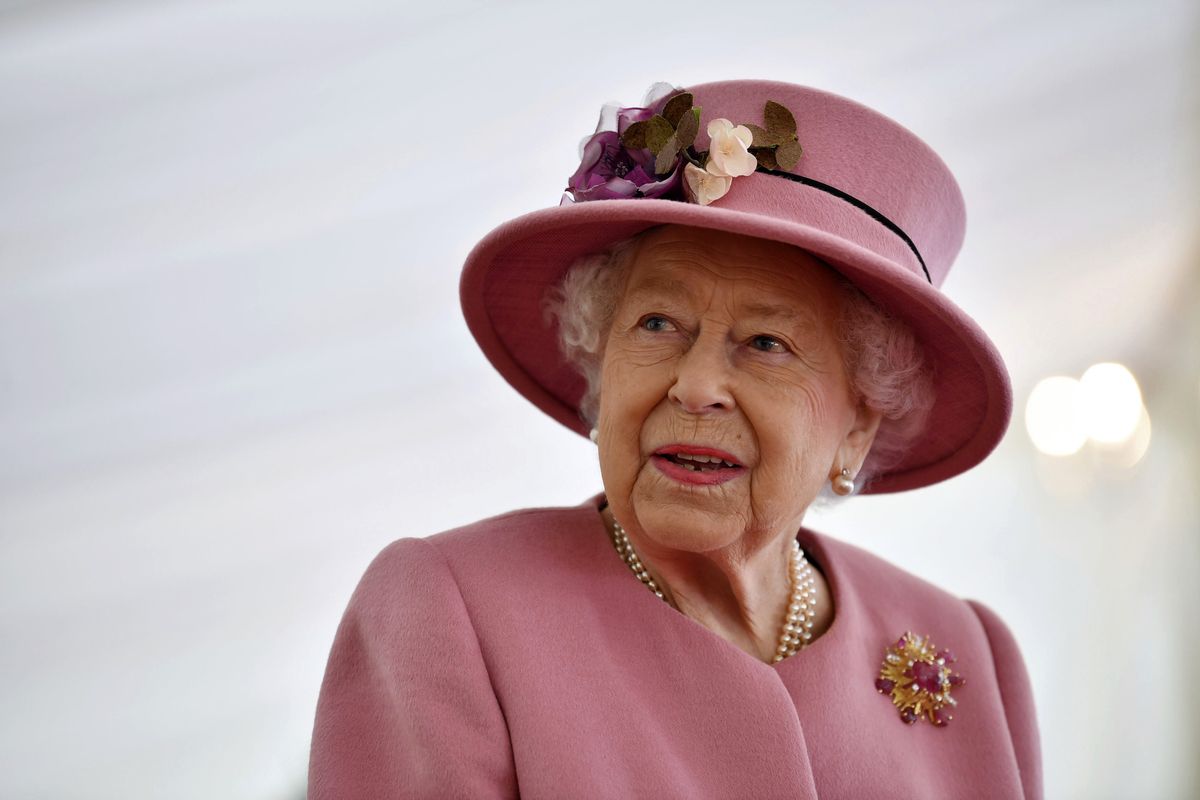 FILE - In this Thursday Oct. 15, 2020 file photo, Britain's Queen Elizabeth II visits the Defence Science and Technology Laboratory (DSTL) at Porton Down, England, to view the Energetics Enclosure and display of weaponry and tactics used in counter intelligence. The death of Prince Philip has left a “huge void” in Queen Elizabeth II’s life, their son Prince Andrew said Sunday April 11, 2021, as well-wishers continued to leave floral tributes outside the gates of royal residences in memory of the monarch's husband.  (Ben Stansall)