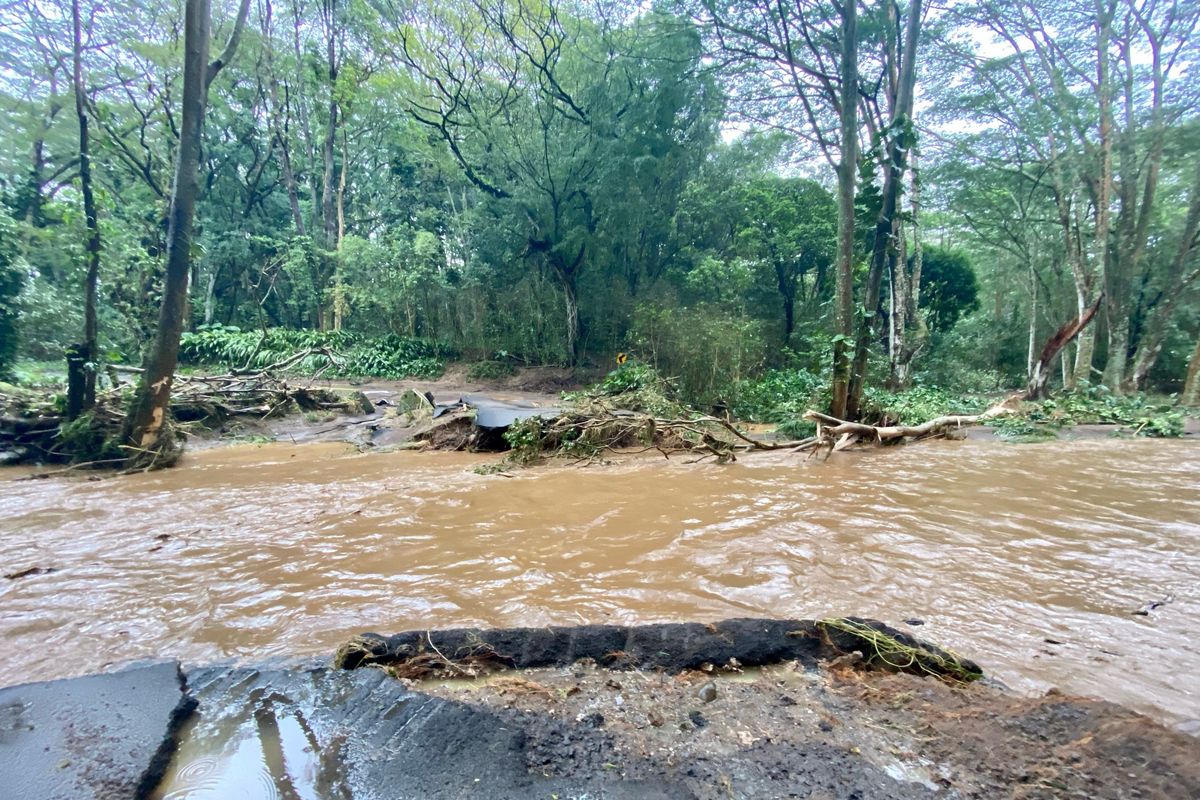 A bridge off Peahi Road is overcome by floodwaters above the Kaupakalua Reservoir and Dam after heavy rainfall on Monday in Haiku, Maui, Hawaii, on Monday, March 8, 2021. Heavy rains caused a dam to overflow on the Hawaiian island of Maui, and and nearby residents in the community of Haiku are being evacuated, county officials said Monday.  (Kehaulani Cerizo)